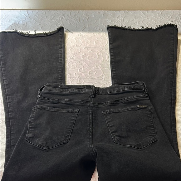 Black Flare Wide Leg Jeans with Smooth Texture. High rise. Flare. Raw hem. 5/26 - Picture 8 of 9